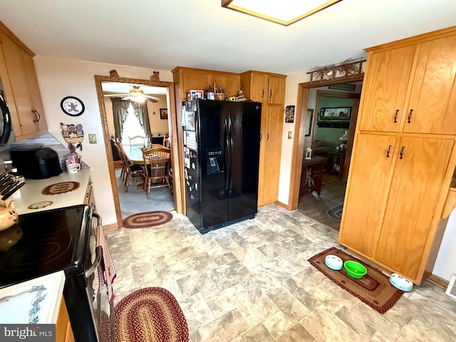 239 S Allison St, Greencastle, PA 17225 - kitchen featuring black appliances, stone finish floors, and baseboards