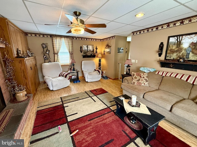 239 S Allison St, Greencastle, PA 17225 - living area featuring a drop ceiling, a ceiling fan, wood finished floors, and baseboards