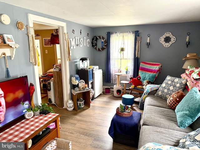 239 S Allison St, Greencastle, PA 17225 - living room with wood finished floors and washer / clothes dryer