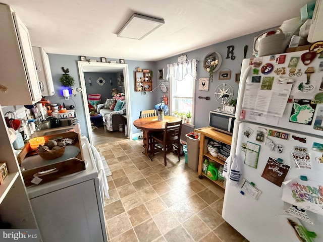239 S Allison St, Greencastle, PA 17225 - kitchen featuring white appliances, white cabinetry, and a sink