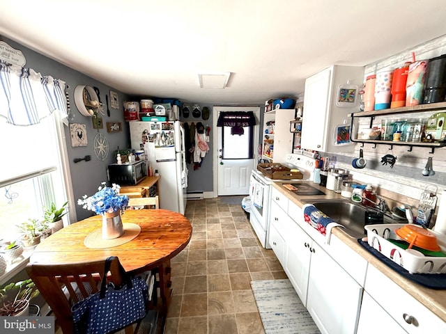 239 S Allison St, Greencastle, PA 17225 - kitchen with white appliances, white cabinetry, light countertops, open shelves, and a sink