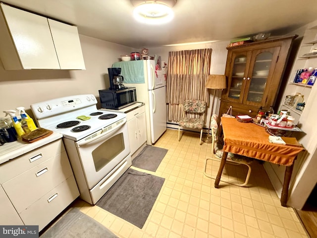 239 S Allison St, Greencastle, PA 17225 - kitchen with white appliances, light countertops, glass insert cabinets, baseboard heating, and white cabinets