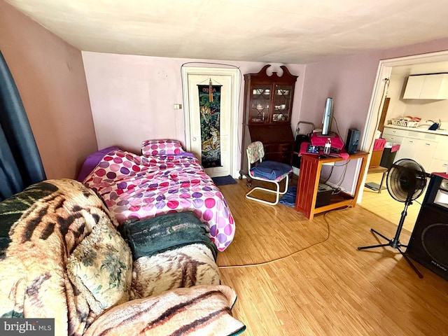 239 S Allison St, Greencastle, PA 17225 - bedroom featuring wood finished floors and washer / dryer