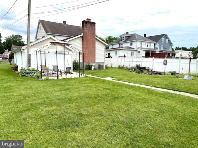 239 S Allison St, Greencastle, PA 17225 - back of house with a gazebo and a chimney