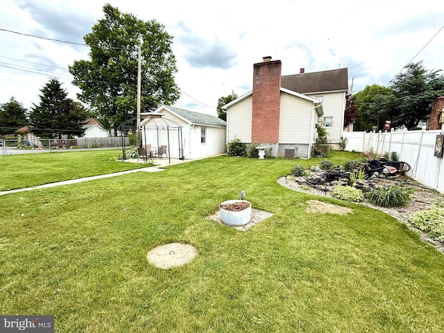 239 S Allison St, Greencastle, PA 17225 - back of property featuring cooling unit and an outbuilding