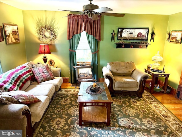 239 S Allison St, Greencastle, PA 17225 - living room with wood finished floors, a ceiling fan, and baseboards