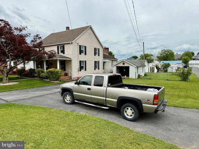 239 S Allison St, Greencastle, PA 17225 - view of front facade featuring a front lawn and asphalt driveway