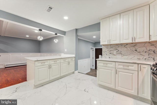 905 Henrietta Ave, Huntingdon Valley, PA 19006 - kitchen with a baseboard radiator, a wainscoted wall, light stone countertops, recessed lighting, and decorative light fixtures