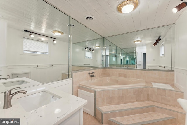 905 Henrietta Ave, Huntingdon Valley, PA 19006 - full bathroom featuring vanity, a bath, tile patterned floors, a wainscoted wall, and wood ceiling