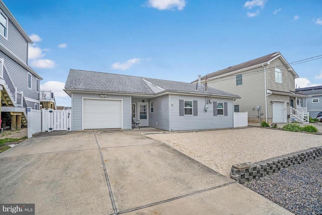 13 Lake Superior, Little Egg Harbor Twp, NJ 08087 - view of front of home featuring concrete driveway, an attached garage, a gate, and roof with shingles