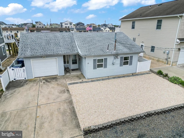 13 Lake Superior, Little Egg Harbor Twp, NJ 08087 - view of front facade featuring driveway, a residential view, a garage, a gate, and roof with shingles