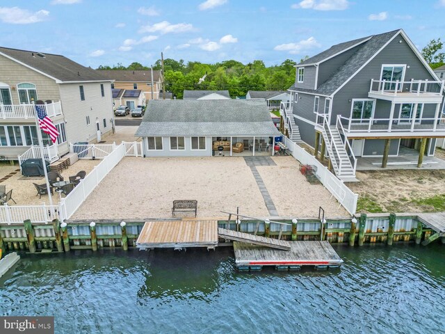 13 Lake Superior, Little Egg Harbor Twp, NJ 08087 - back of house featuring a fenced backyard, roof with shingles, a residential view, and a deck with water view