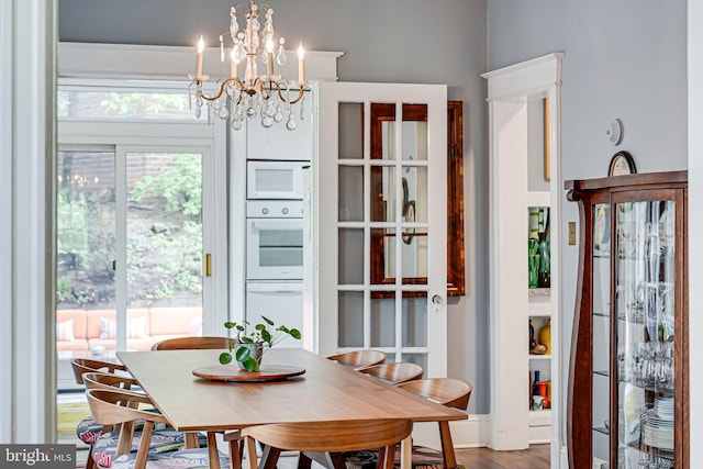 3100 Rodman St NW, Washington, DC 20008 - dining space with a chandelier and wood finished floors