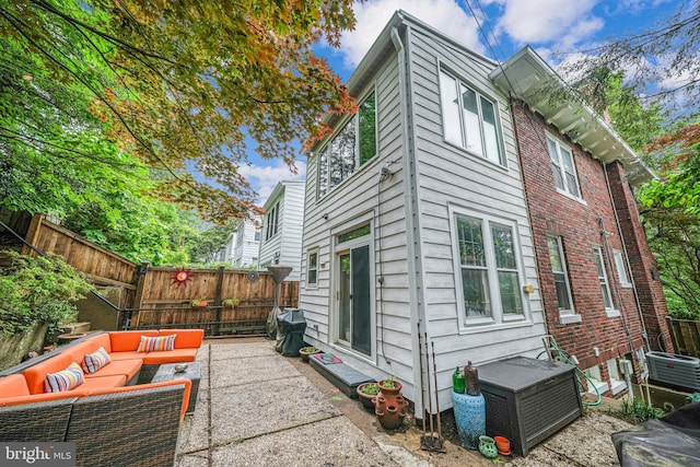 3100 Rodman St NW, Washington, DC 20008 - view of side of property featuring an outdoor hangout area, a fenced backyard, and a patio