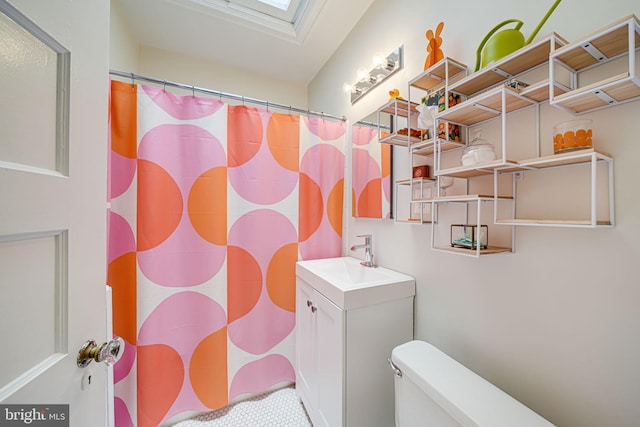 3100 Rodman St NW, Washington, DC 20008 - bathroom featuring vanity, toilet, a skylight, and a shower with shower curtain