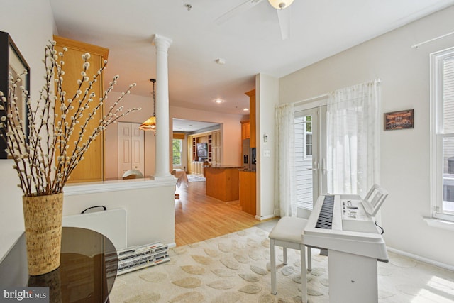 13146 Diamond Hill Dr, Germantown, MD 20874 - unfurnished office featuring decorative columns, light wood-style flooring, a ceiling fan, and baseboards