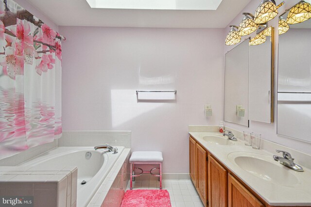 13146 Diamond Hill Dr, Germantown, MD 20874 - bathroom featuring a skylight, a garden tub, baseboards, and double vanity