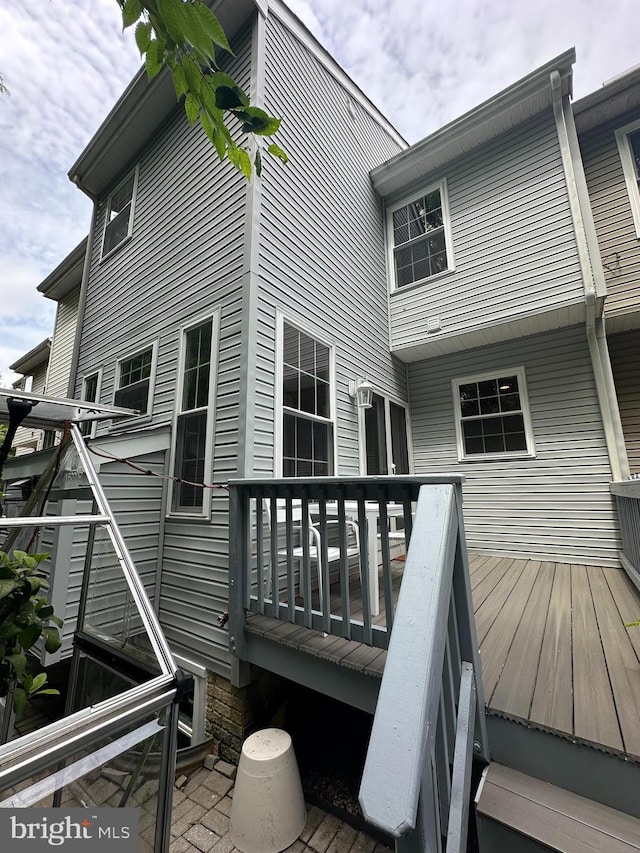 13146 Diamond Hill Dr, Germantown, MD 20874 - rear view of property with a wooden deck