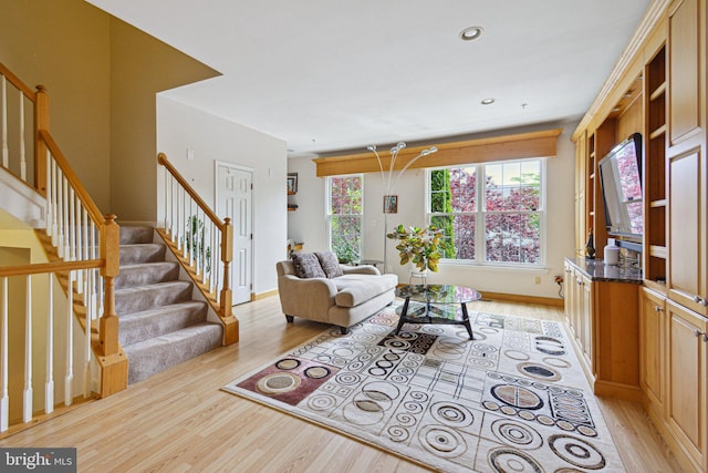 13146 Diamond Hill Dr, Germantown, MD 20874 - living area featuring light wood finished floors, stairs, and recessed lighting