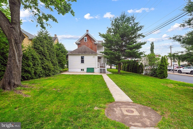 20 N Richardson Ave, Lansdale, PA 19446 - back of house featuring a yard and a chimney