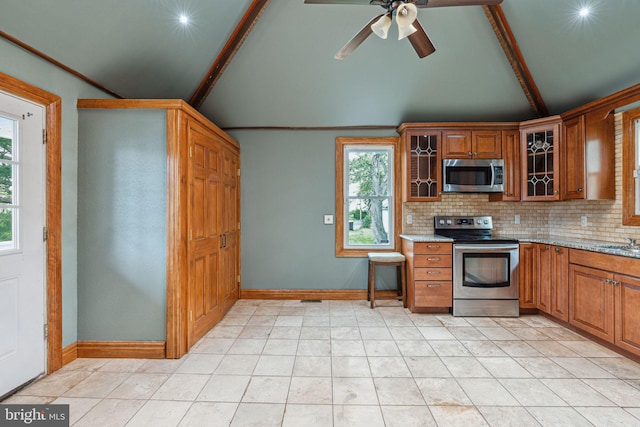 20 N Richardson Ave, Lansdale, PA 19446 - kitchen with stainless steel appliances, decorative backsplash, ceiling fan, brown cabinets, and glass insert cabinets