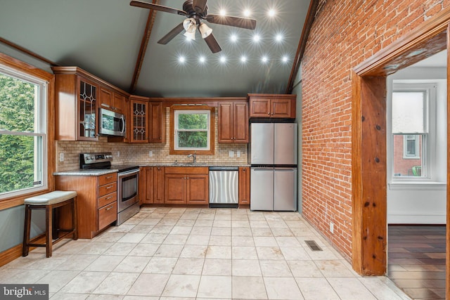 20 N Richardson Ave, Lansdale, PA 19446 - kitchen featuring stainless steel appliances, plenty of natural light, decorative backsplash, light stone counters, and beam ceiling