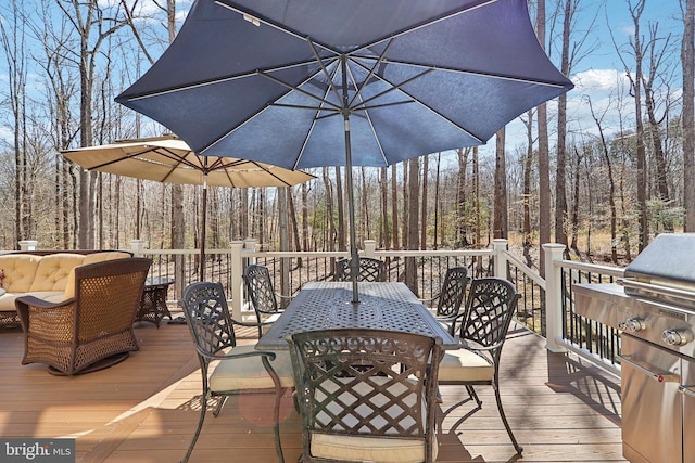 7951 Kelly Ann Ct, Fairfax Station, VA 22039 - wooden terrace featuring outdoor dining area, a wooded view, and grilling area