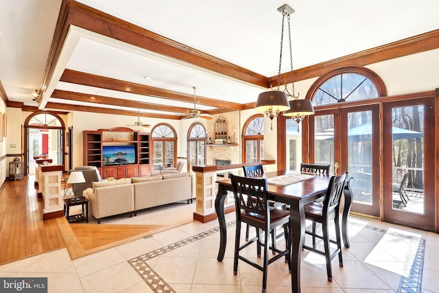 7951 Kelly Ann Ct, Fairfax Station, VA 22039 - dining room with beamed ceiling, ornamental molding, a chandelier, light tile patterned flooring, and inlaid floor details