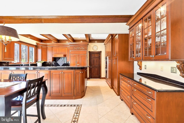 7951 Kelly Ann Ct, Fairfax Station, VA 22039 - kitchen featuring beam ceiling, light tile patterned floors, glass insert cabinets, dark countertops, and brown cabinetry