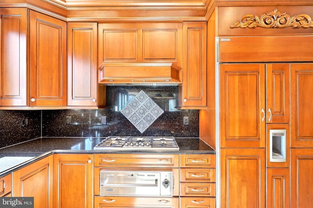 7951 Kelly Ann Ct, Fairfax Station, VA 22039 - kitchen featuring stainless steel gas cooktop, paneled built in fridge, a warming drawer, tasteful backsplash, and brown cabinetry