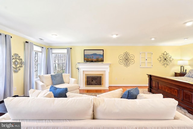 7951 Kelly Ann Ct, Fairfax Station, VA 22039 - living room featuring ornamental molding, a fireplace with flush hearth, wood finished floors, recessed lighting, and baseboards