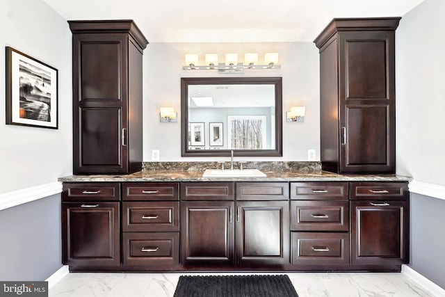 7951 Kelly Ann Ct, Fairfax Station, VA 22039 - bathroom featuring marble look tile flooring, vanity, and baseboards
