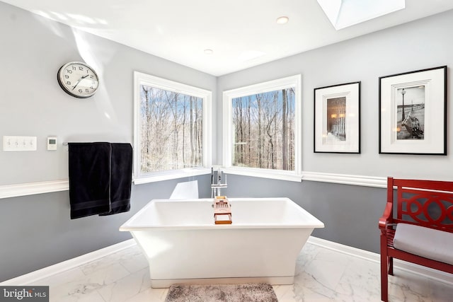 7951 Kelly Ann Ct, Fairfax Station, VA 22039 - full bathroom featuring marble finish floors, a soaking tub, baseboards, a skylight, and recessed lighting