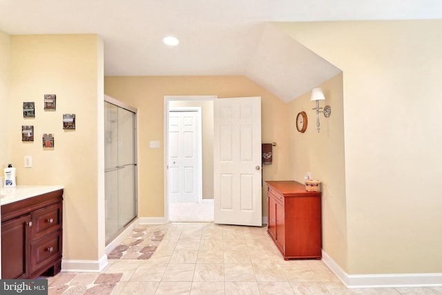 7951 Kelly Ann Ct, Fairfax Station, VA 22039 - bathroom with vanity, a stall shower, lofted ceiling, baseboards, and recessed lighting