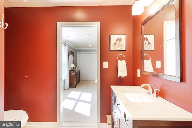 7951 Kelly Ann Ct, Fairfax Station, VA 22039 - bathroom with vanity, toilet, ornamental molding, and baseboards