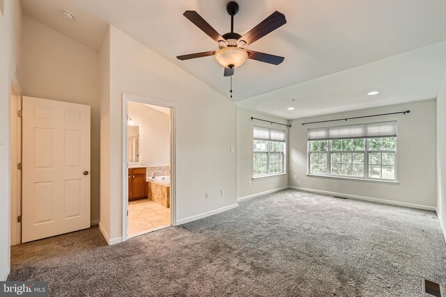 11606 Amaralles Dr, Reisterstown, MD 21136 - unfurnished bedroom featuring carpet flooring, baseboards, lofted ceiling, and connected bathroom