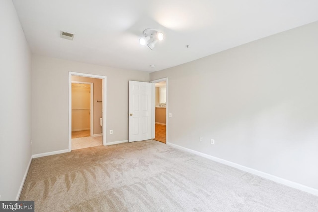 18707 Sparkling Water Dr Unit 3, Germantown, MD 20874 - unfurnished bedroom with light colored carpet and baseboards