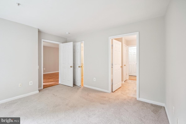 18707 Sparkling Water Dr Unit 3, Germantown, MD 20874 - unfurnished bedroom with carpet floors and baseboards