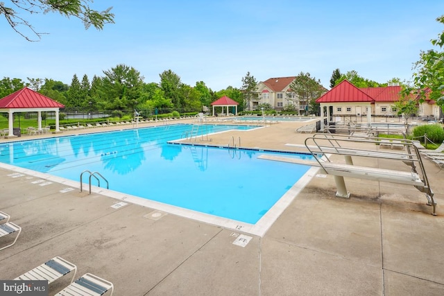 18707 Sparkling Water Dr Unit 3, Germantown, MD 20874 - community pool featuring a gazebo, a patio area, and view of wooded area