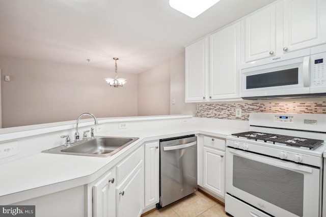 18707 Sparkling Water Dr Unit 3, Germantown, MD 20874 - kitchen with white appliances, a sink, a chandelier, and white cabinets