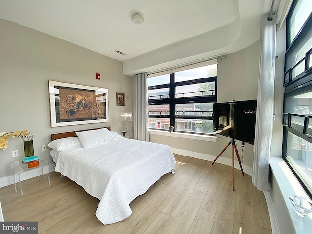 1111 Orren St NE Unit 300, Washington, DC 20002 - bedroom featuring wood finished floors and baseboards