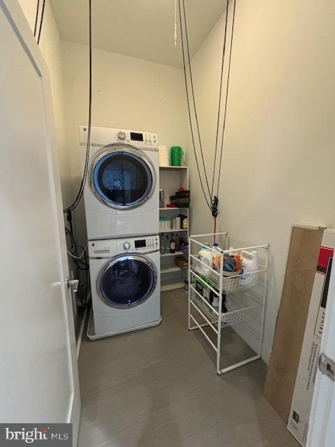 1111 Orren St NE Unit 300, Washington, DC 20002 - laundry room with stacked washer and clothes dryer