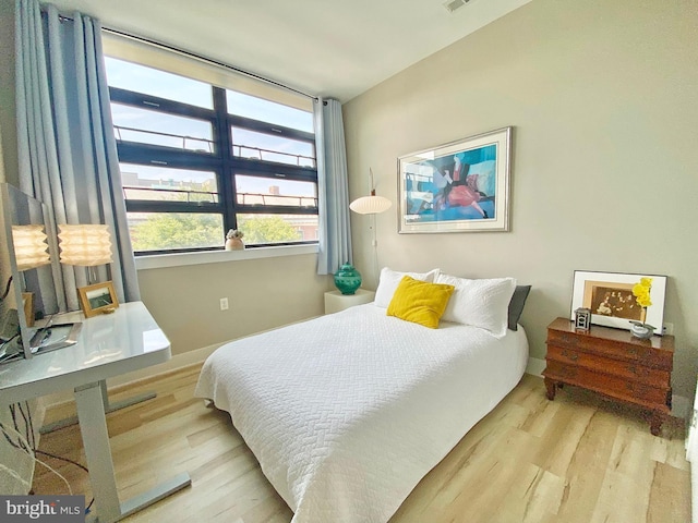 1111 Orren St NE Unit 300, Washington, DC 20002 - bedroom with wood finished floors and baseboards