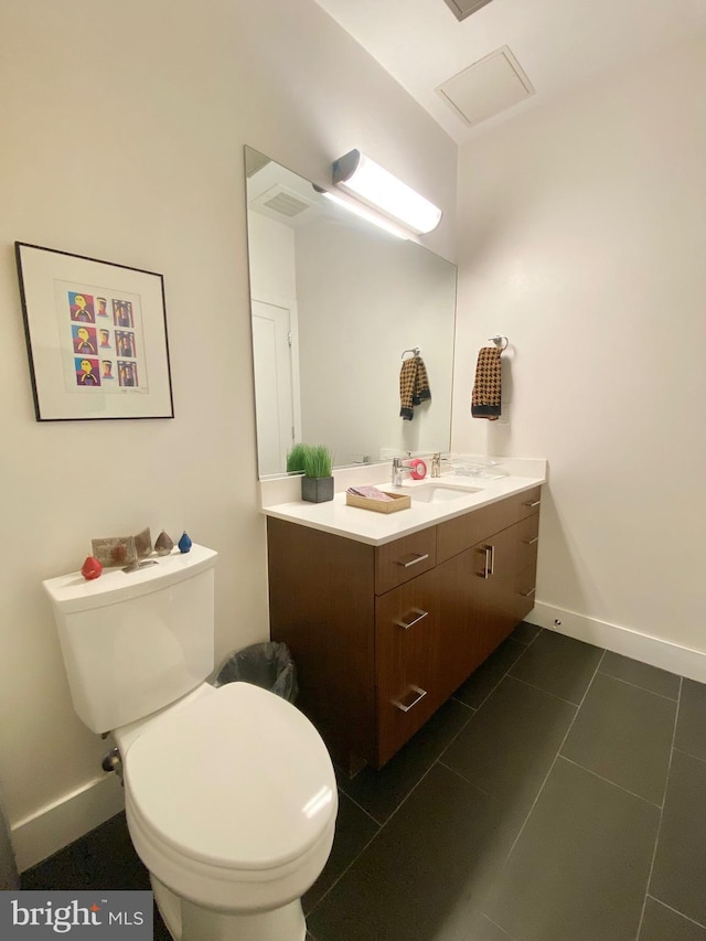 1111 Orren St NE Unit 300, Washington, DC 20002 - half bath featuring vanity, toilet, tile patterned flooring, and baseboards