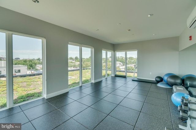 1111 Orren St NE Unit 300, Washington, DC 20002 - exercise room featuring baseboards and a wall unit AC