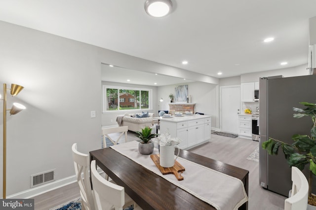 3015 Logan St, District Heights, MD 20747 - dining space with light wood-style flooring, baseboards, and recessed lighting