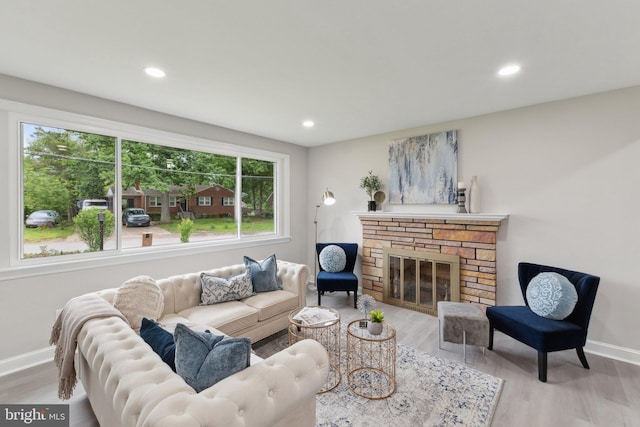 3015 Logan St, District Heights, MD 20747 - living area featuring baseboards, wood finished floors, a fireplace, and recessed lighting