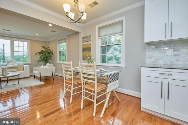 6823 Donahue Ct, Falls Church, VA 22042 - dining area featuring crown molding, baseboards, light wood-type flooring, a chandelier, and recessed lighting