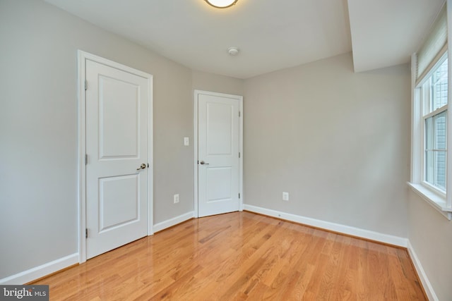 6823 Donahue Ct, Falls Church, VA 22042 - unfurnished bedroom featuring light wood-type flooring and baseboards