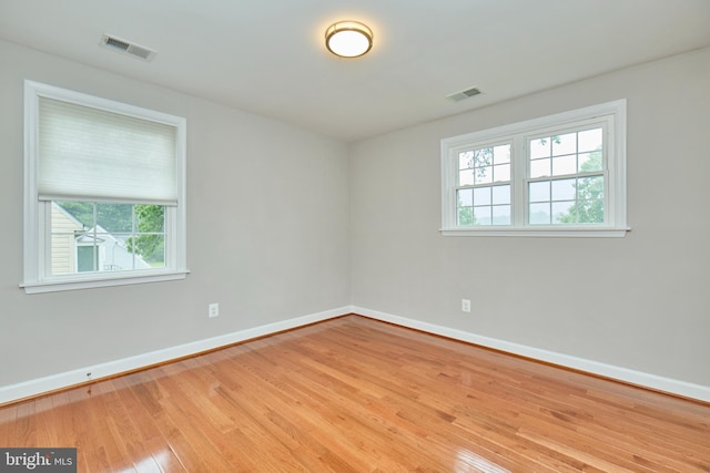 6823 Donahue Ct, Falls Church, VA 22042 - empty room with healthy amount of natural light, baseboards, and wood finished floors